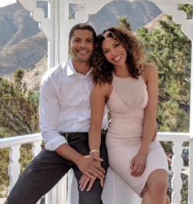Ciera Payton with her partner Aaron Burgess. the couple are holding each other's hands
